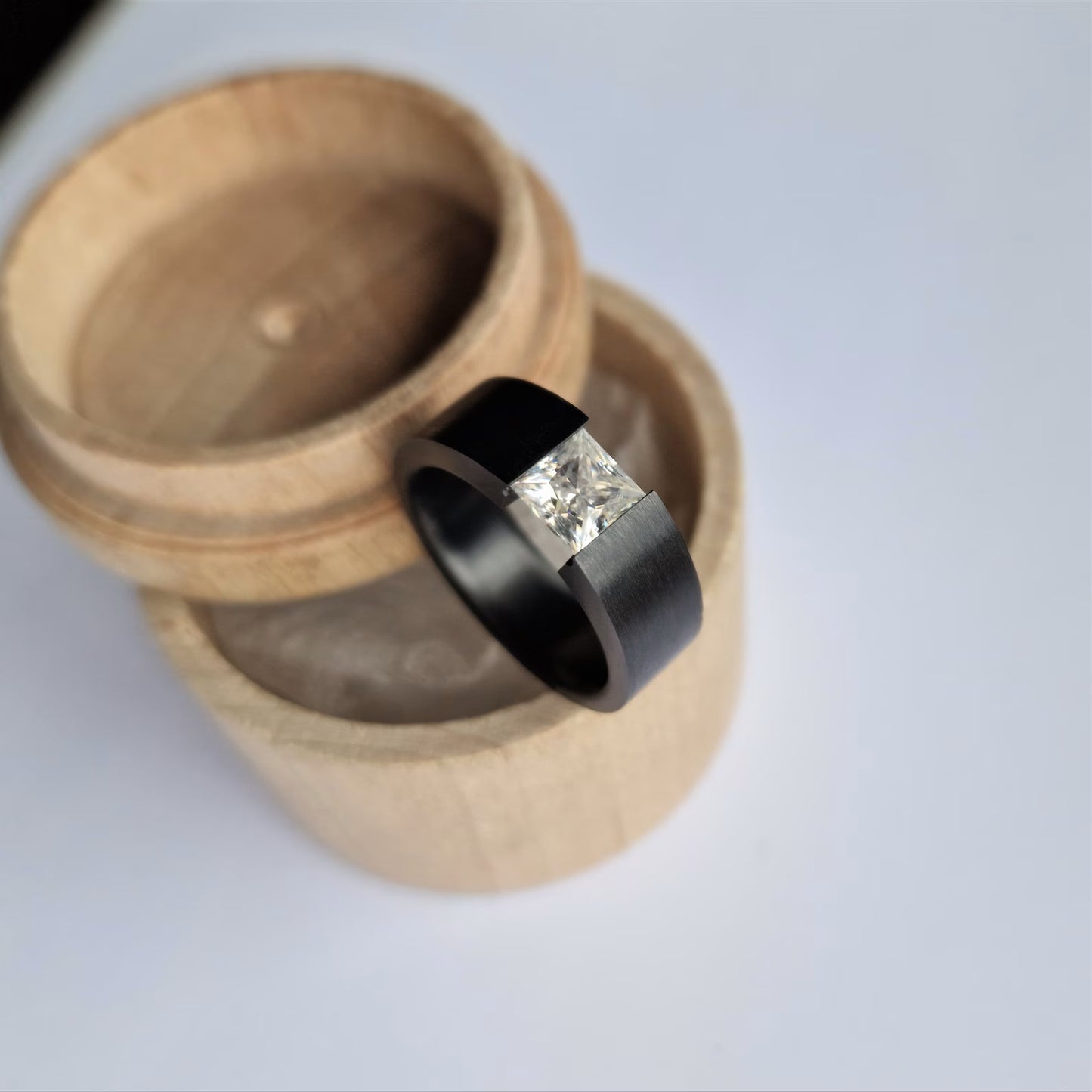 Unique Handmade Black Zirconium Tension Band with Princess Cut Gemstone Setting.