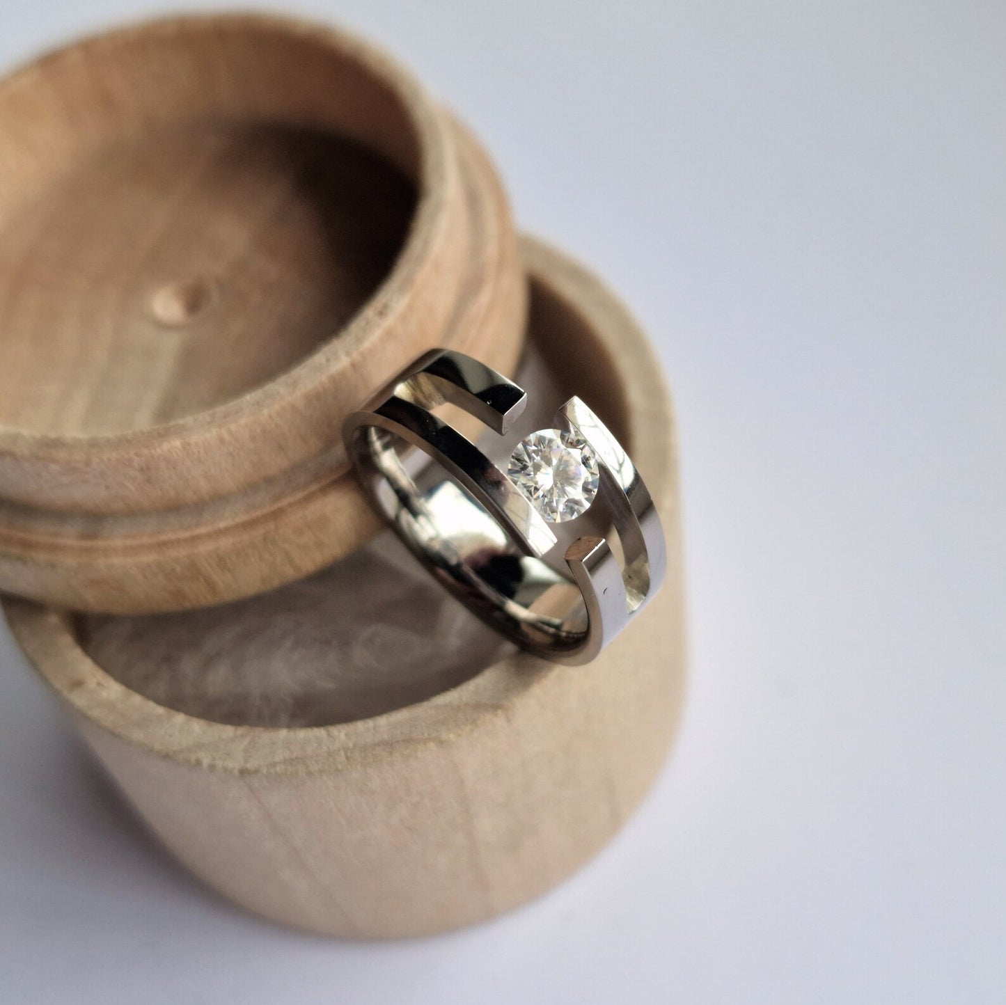 Unique Handmade Polished Titanium Tension Ring with Round Brilliant Cut Gemstone Setting.