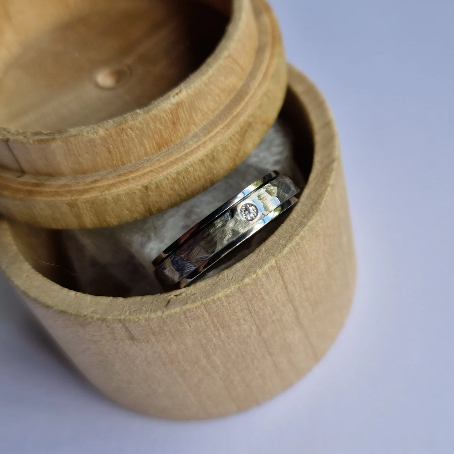 Handmade Flush Set Faceted Titanium Spinner Band.