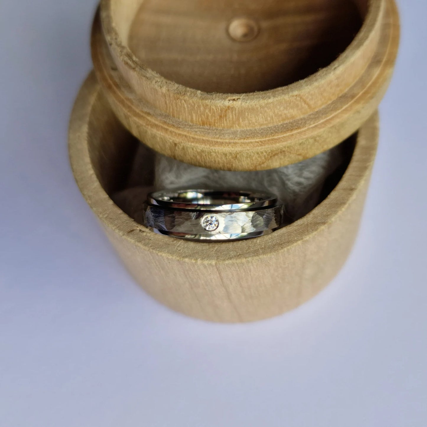 Handmade Flush Set Faceted Titanium Spinner Band.
