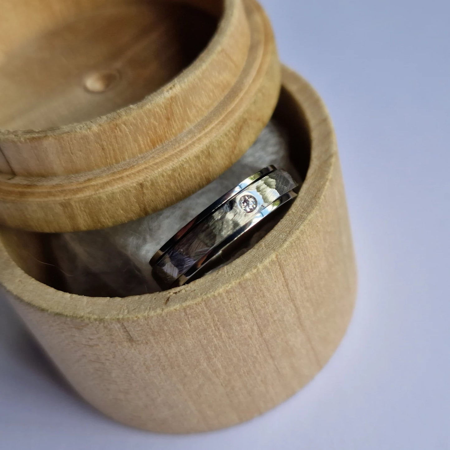 Handmade Flush Set Faceted Titanium Spinner Band.
