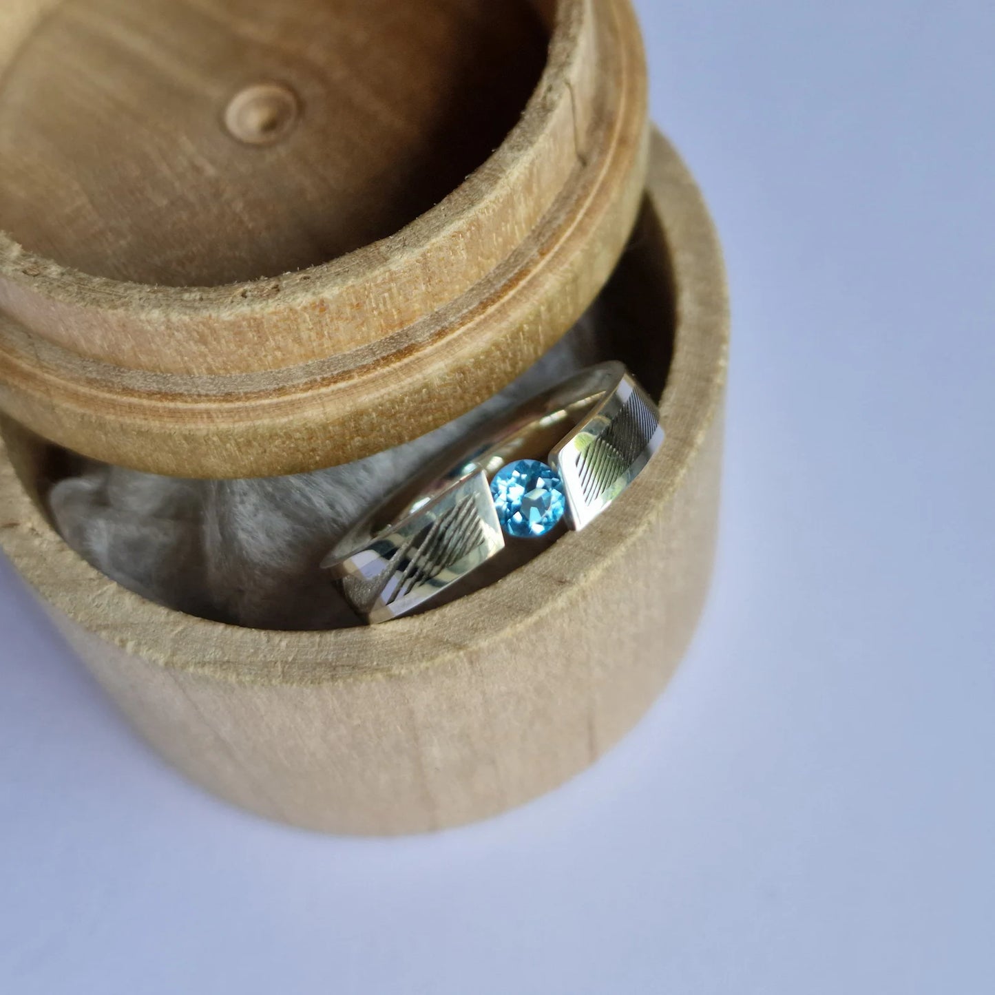 Handmade Polished Sterling Silver/Solid Gold and Stainless Damascus Steel Tension Ring with a Round Brilliant Cut Gemstone Setting.