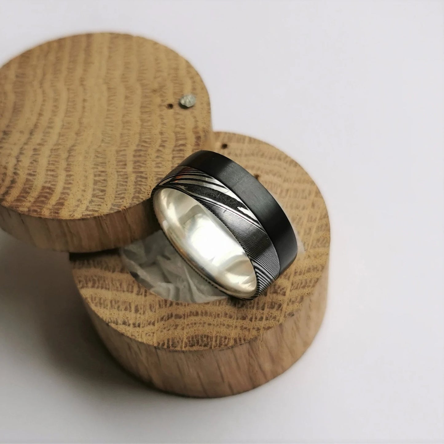 Unique Brushed Black Zirconium and Stainless Damascus Steel Band with Sterling Silver / Solid Gold Inner Lining.