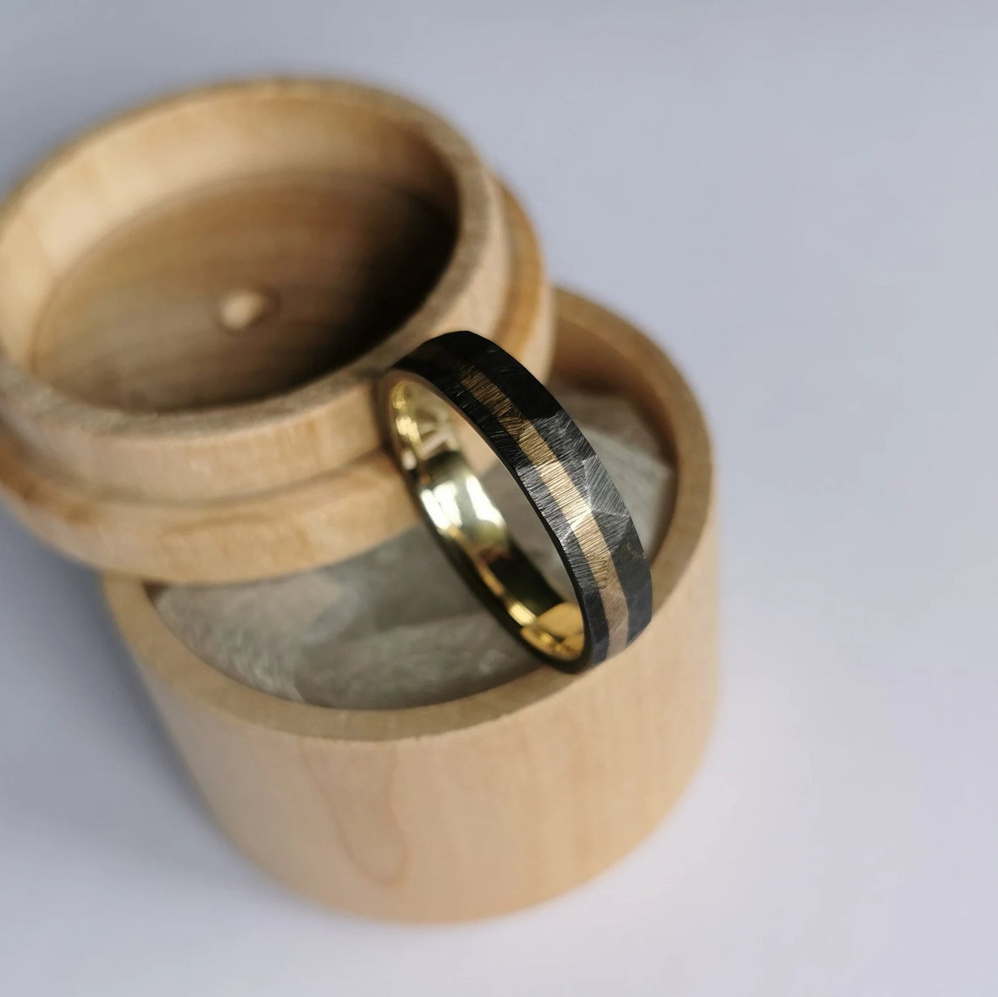 Handmade Faceted Black Zirconium and Solid Gold Band.