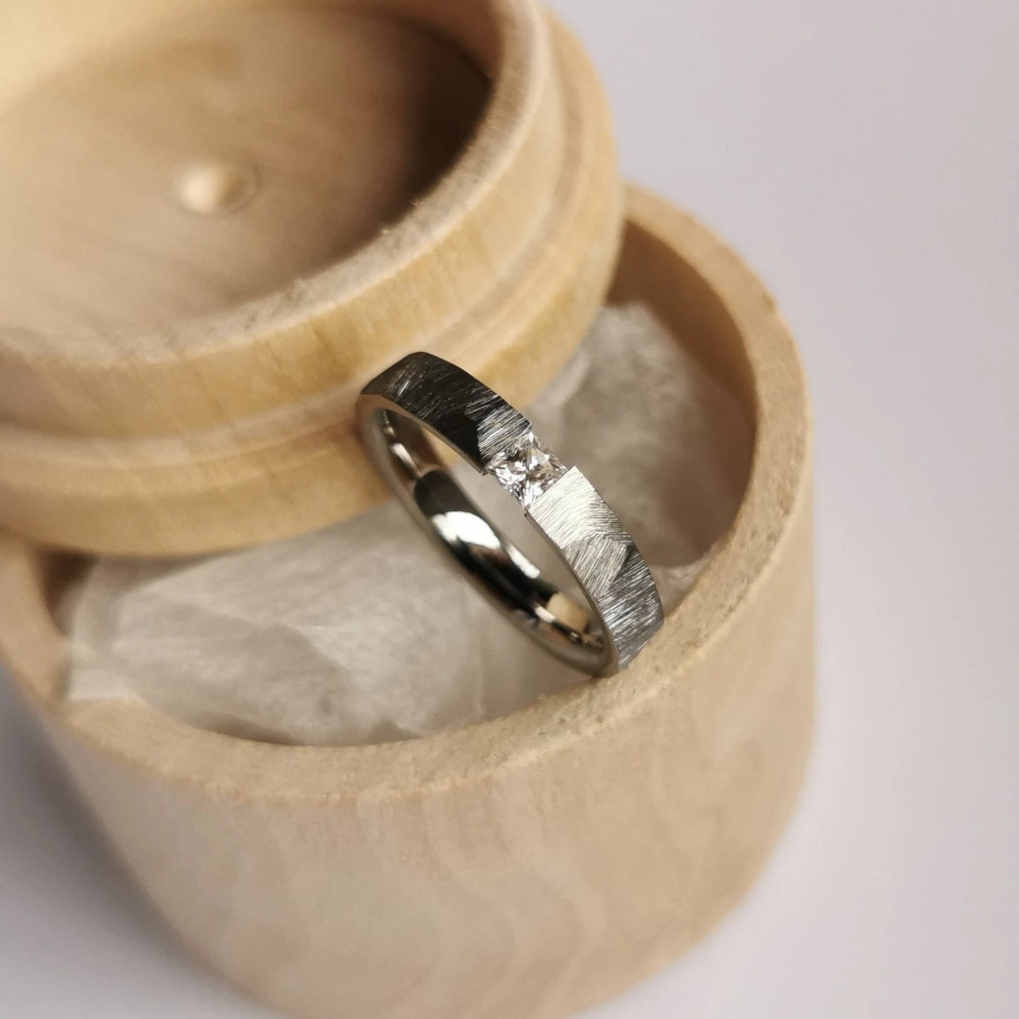 Unique Handmade Faceted Titanium Tension Ring with Square Princess Cut Stone Setting.
