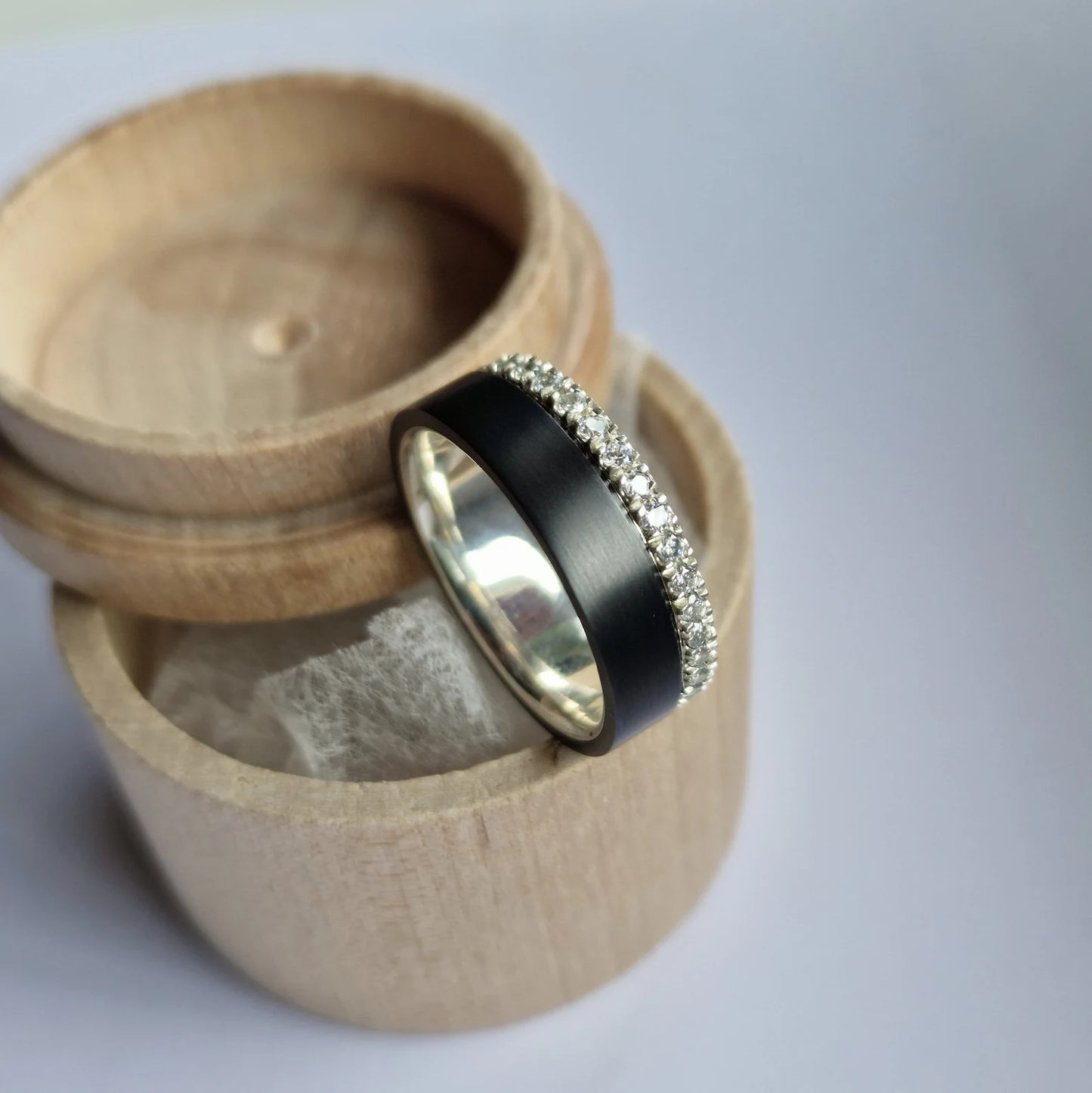 Black Zirconium and Solid Gold / Silver Band with French Set Moissanites.