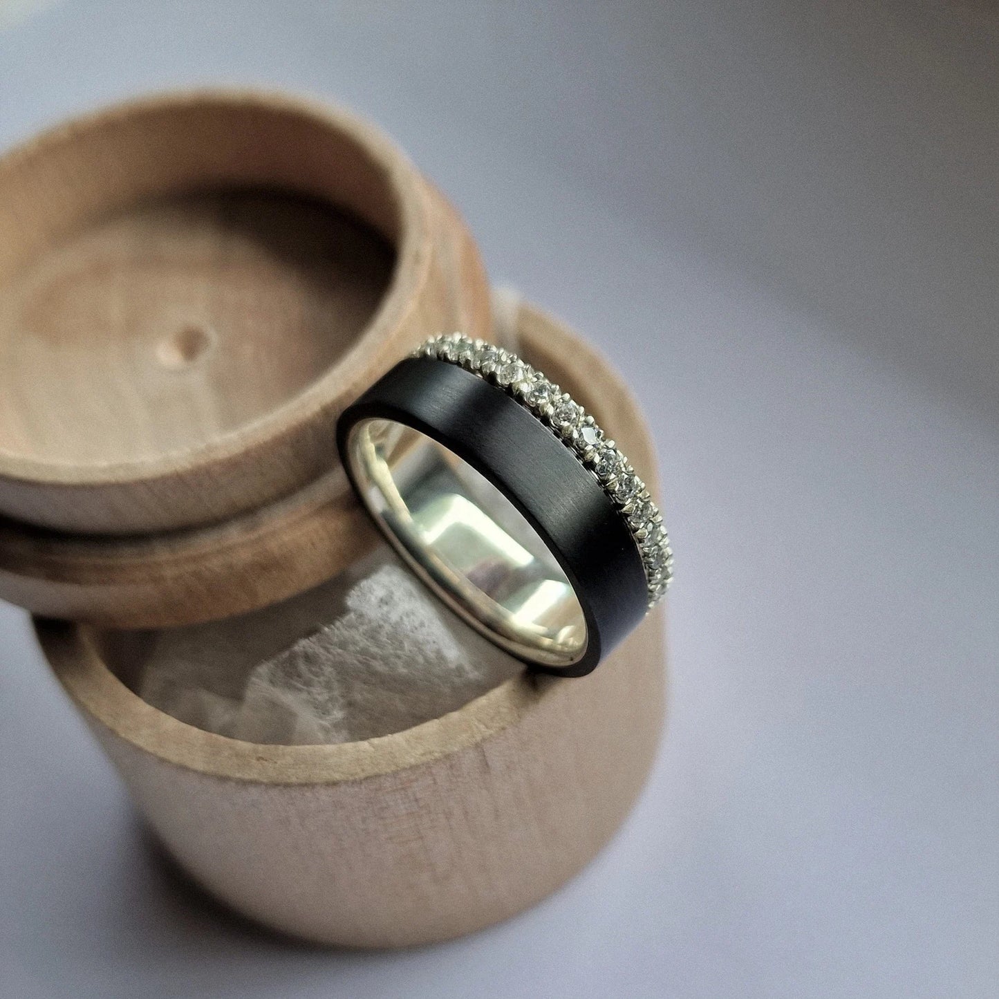 Black Zirconium and Solid Gold / Silver Band with French Set Moissanites.