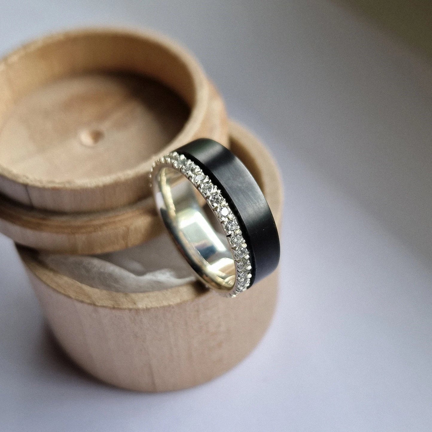 Black Zirconium and Solid Gold / Silver Band with French Set Moissanites.