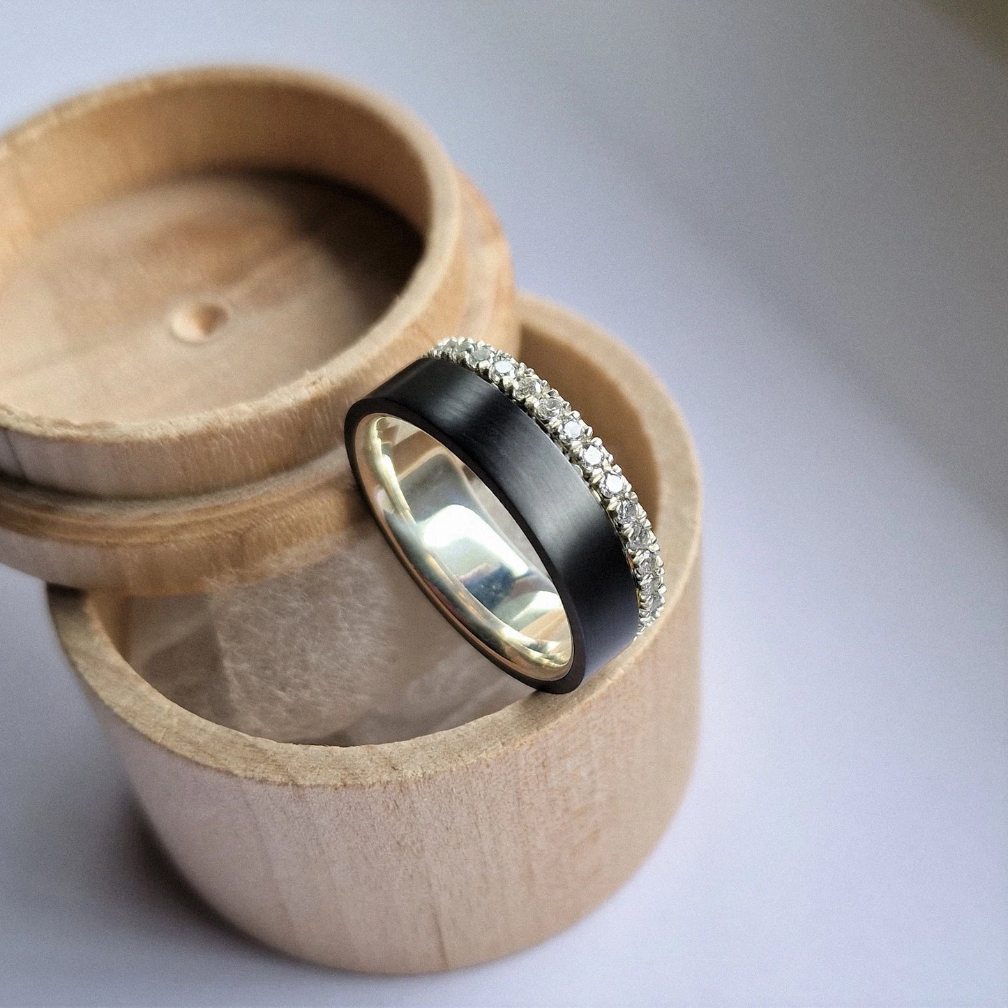 Black Zirconium and Solid Gold / Silver Band with French Set Moissanites.