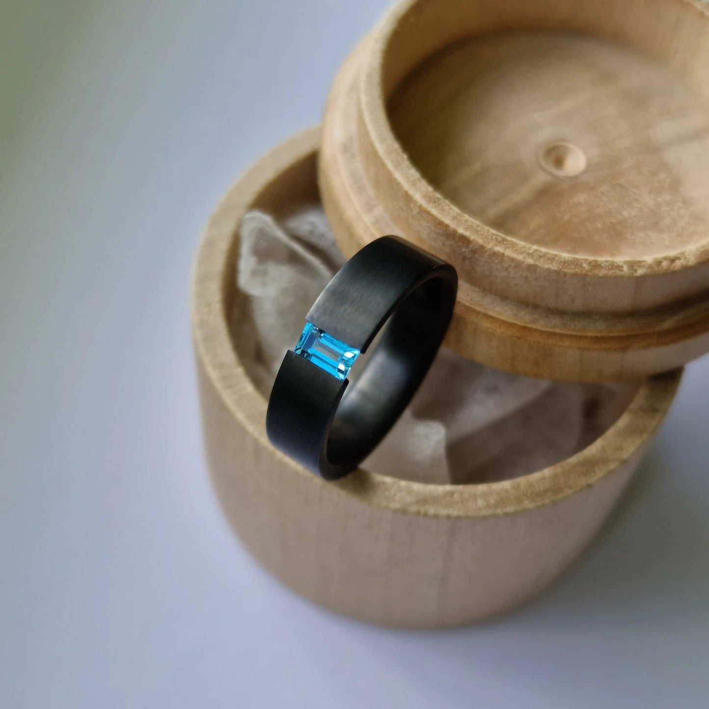 Unique Handmade Black Zirconium Tension Band with Baguette Cut Stone Setting.