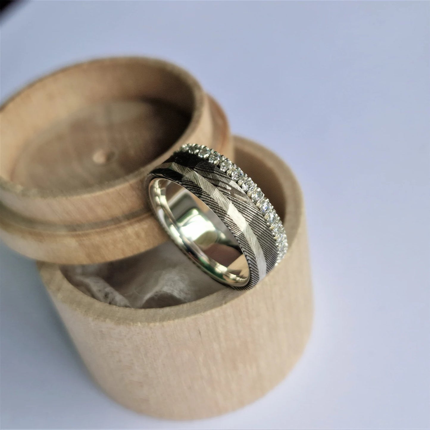 Unique Stainless Damascus Steel and Sterling Silver Band with Round Brilliant Cut Moissanite Setting.