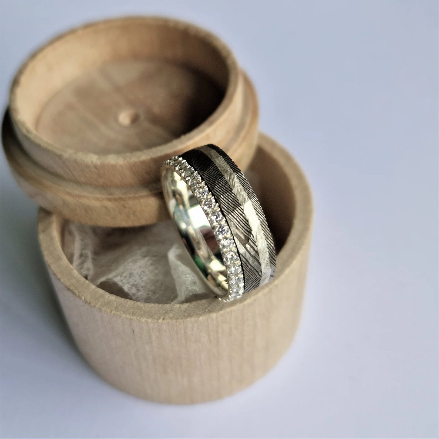 Unique Stainless Damascus Steel and Sterling Silver Band with Round Brilliant Cut Moissanite Setting.