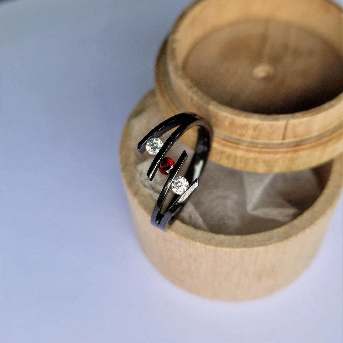 Unique Handmade Polished Black Zirconium Tension Ring with Round Brilliant Cut Stone Setting.