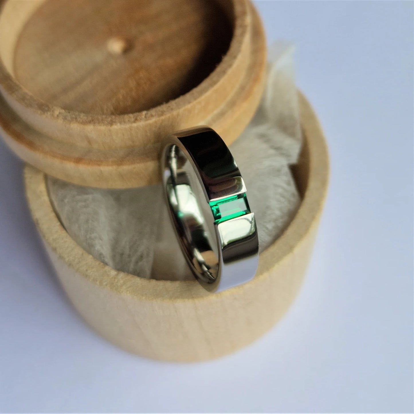 Polished Titanium Tension Band with Baguette Cut Stone Setting.