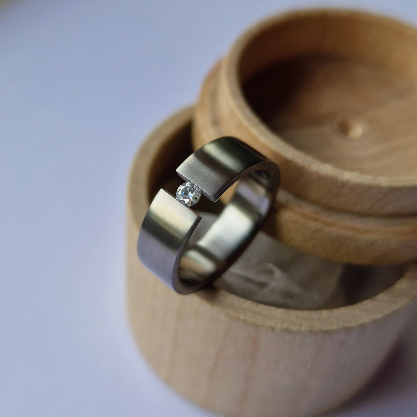 Unique Handmade Brushed Titanium Tension Ring with Round Brilliant Cut Stone Setting.