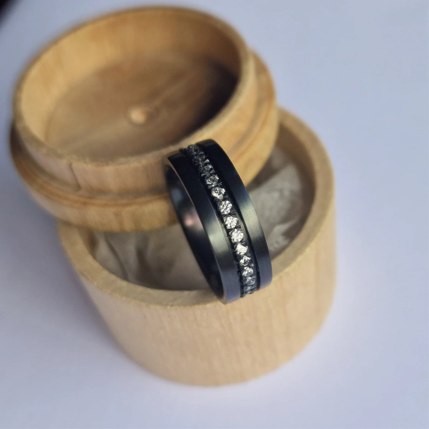 Moissanite Set Black Zirconium Band.