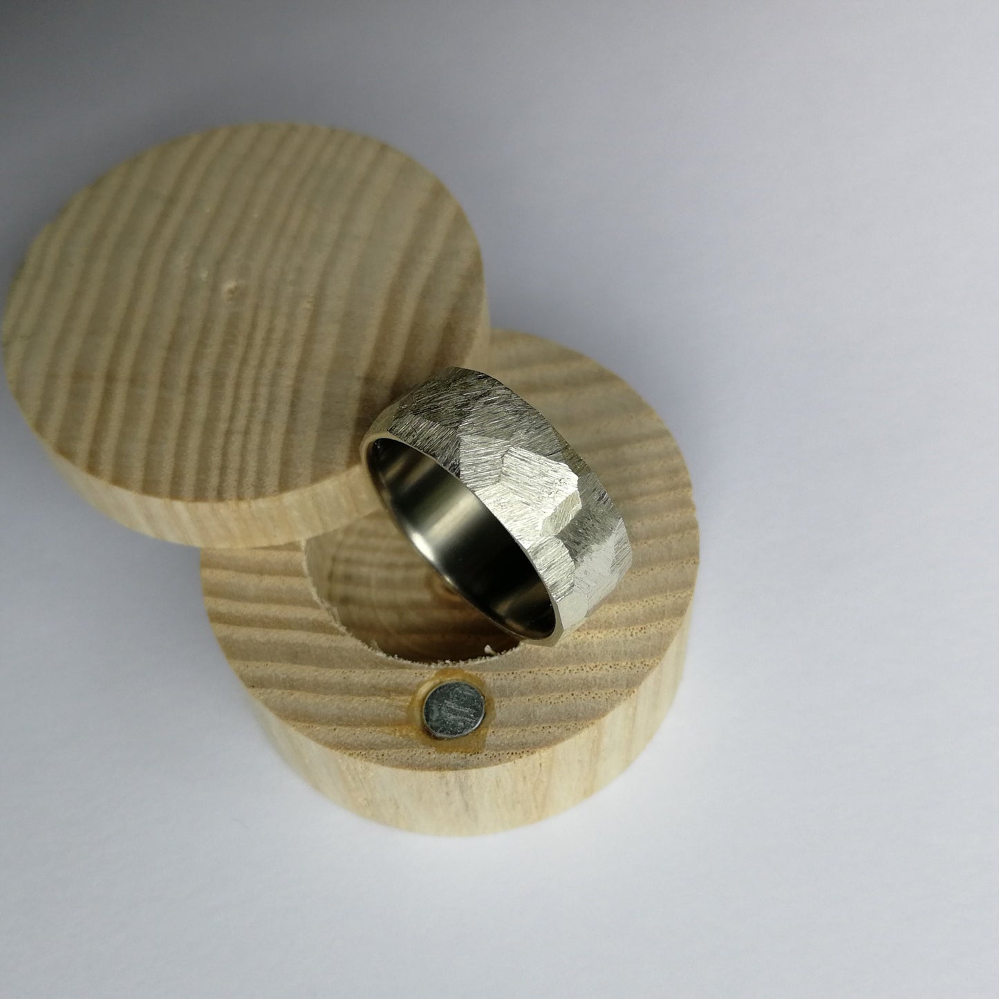 Handmade Rough Finish Faceted Silver Ring with Brushed Titanium Core.