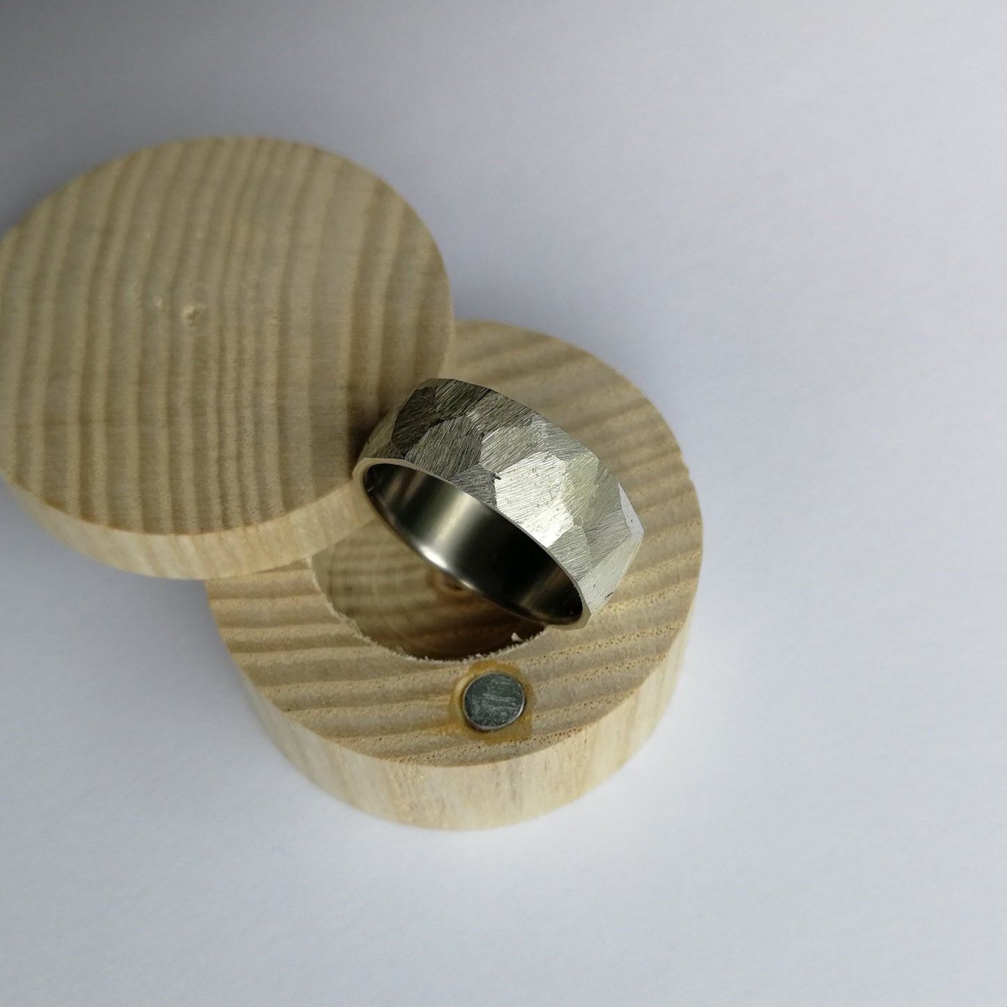 Handmade Rough Finish Faceted Silver Ring with Brushed Titanium Core.