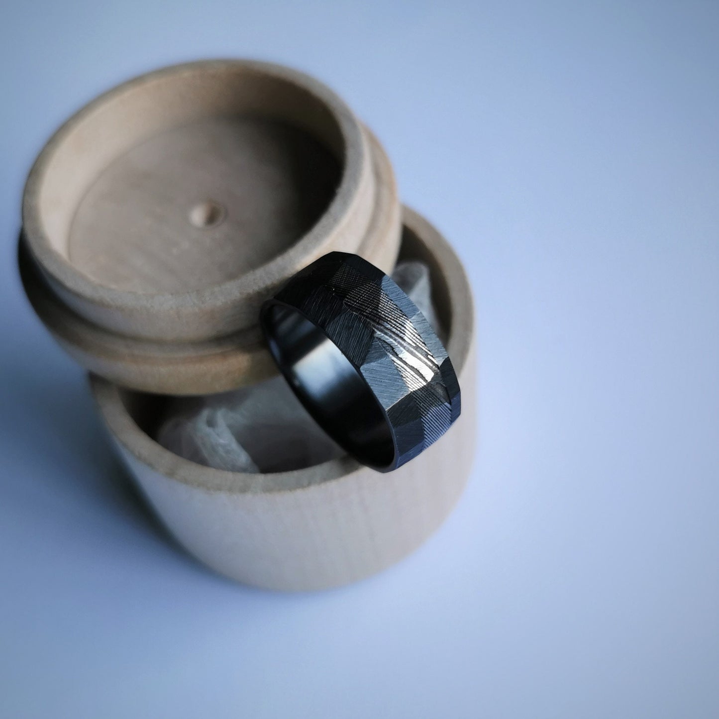 Rough Finish Faceted Black Zirconium and Stainless Damascus Steel Band.