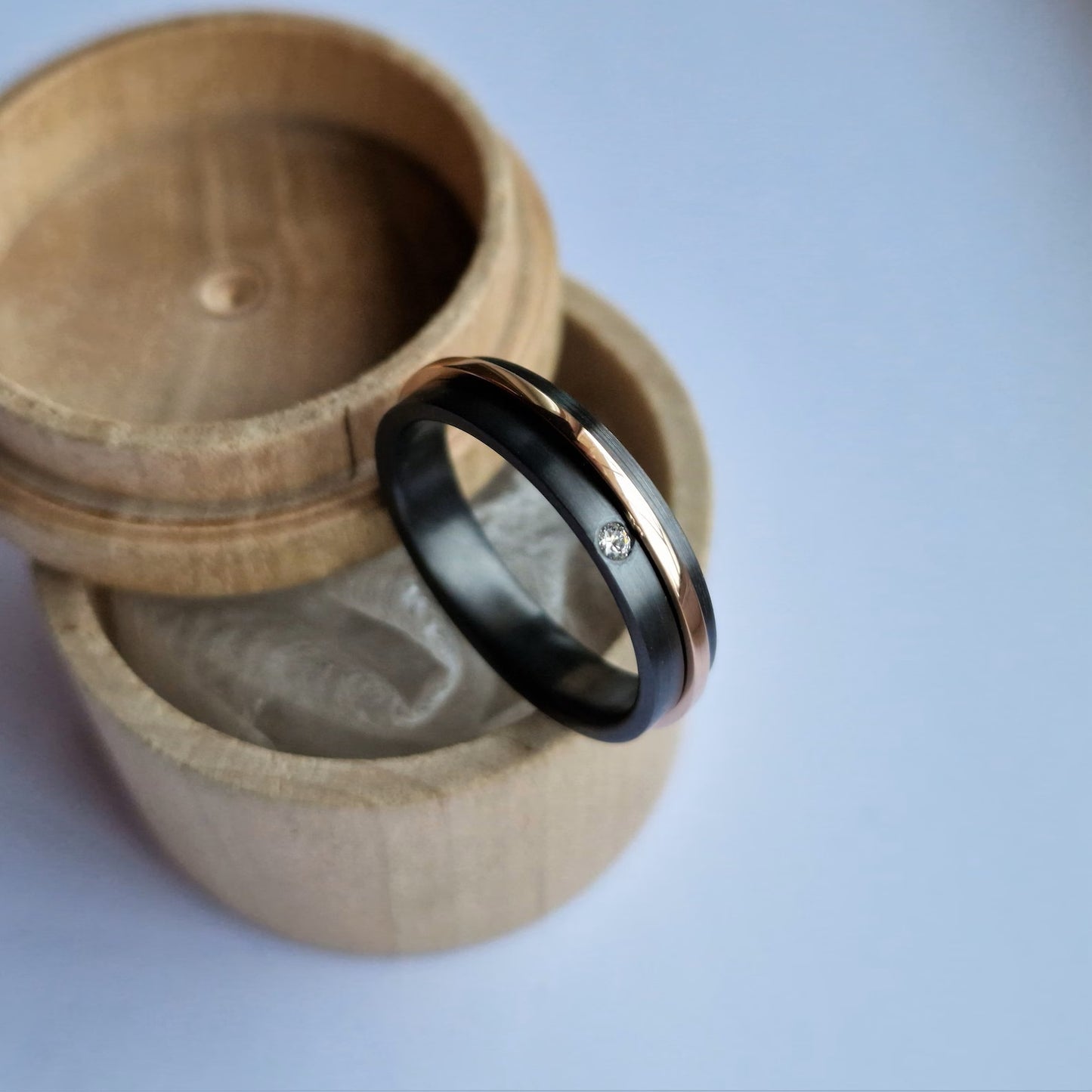 Black Zirconium and Solid Gold Spinner Ring-Band with Flush Set Stone.