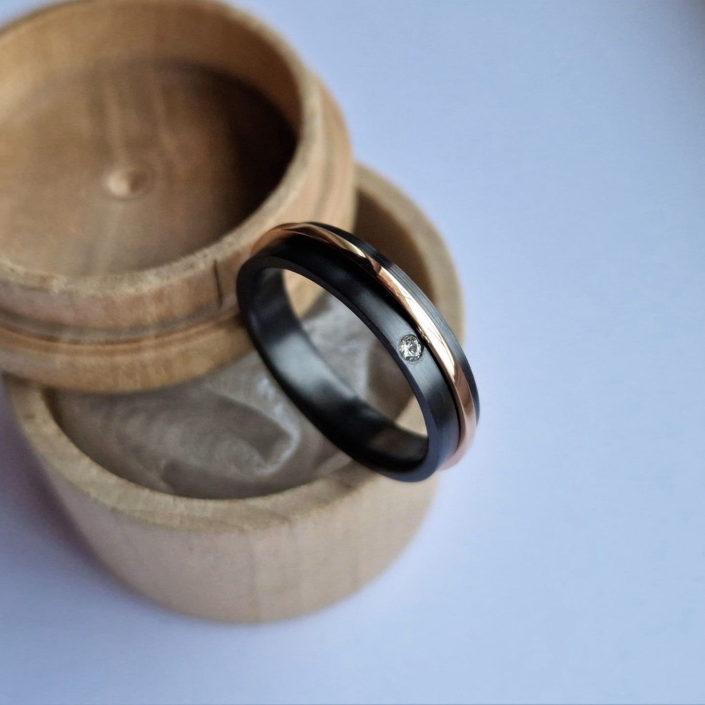 Black Zirconium and Solid Gold Spinner Ring-Band with Flush Set Stone.