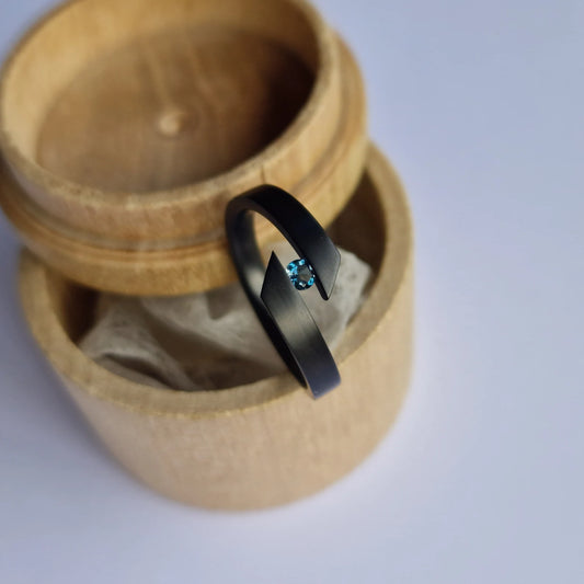 Unique Handmade Brushed Zirconium Tension Ring with Round Brilliant Cut Stone Setting.