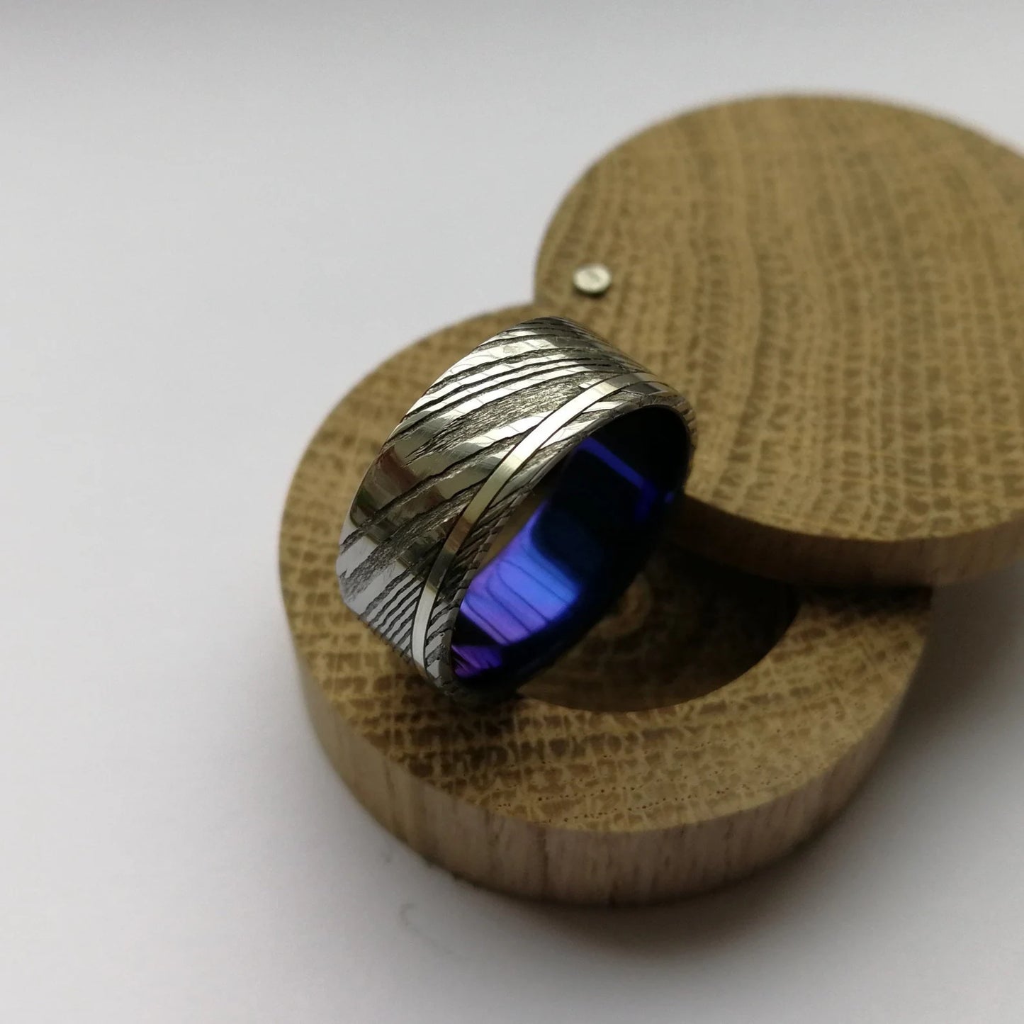 Custom Anodized Titanium and Stainless Damascus Steel Ring with Sterling Silver / Solid Gold Channel.