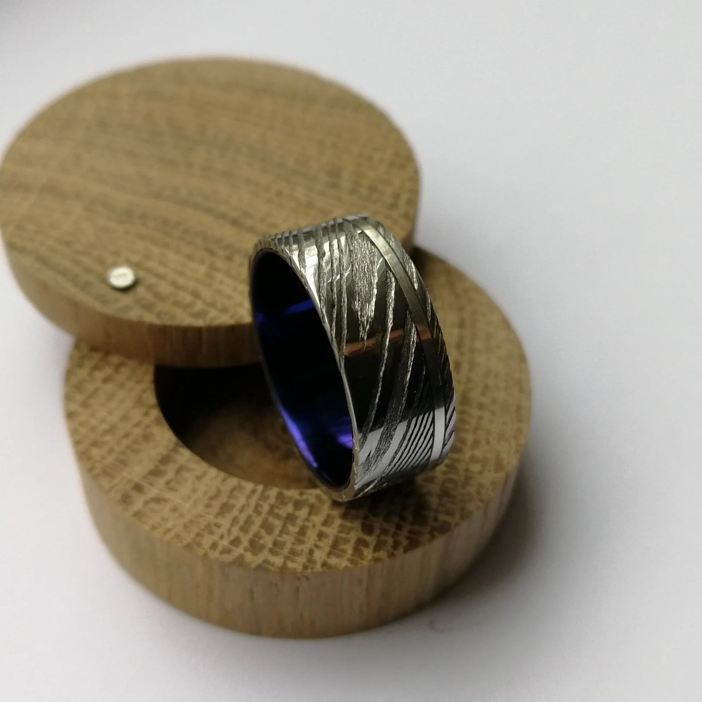 Custom Anodized Titanium and Stainless Damascus Steel Ring with Sterling Silver / Solid Gold Channel.