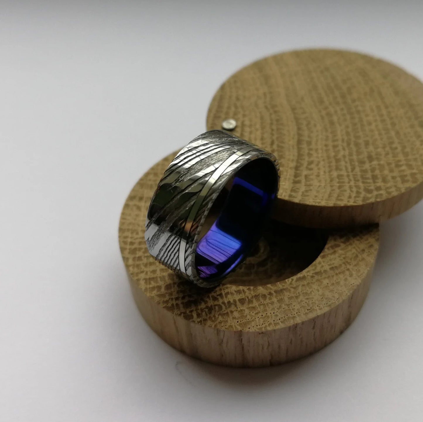 Custom Anodized Titanium and Stainless Damascus Steel Ring with Sterling Silver / Solid Gold Channel.