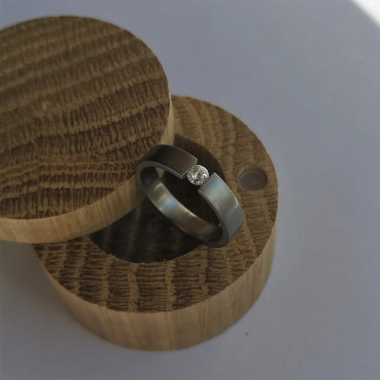 Unique Handmade Brushed Titanium Tension Ring with Round Brilliant Cut Stone Setting.