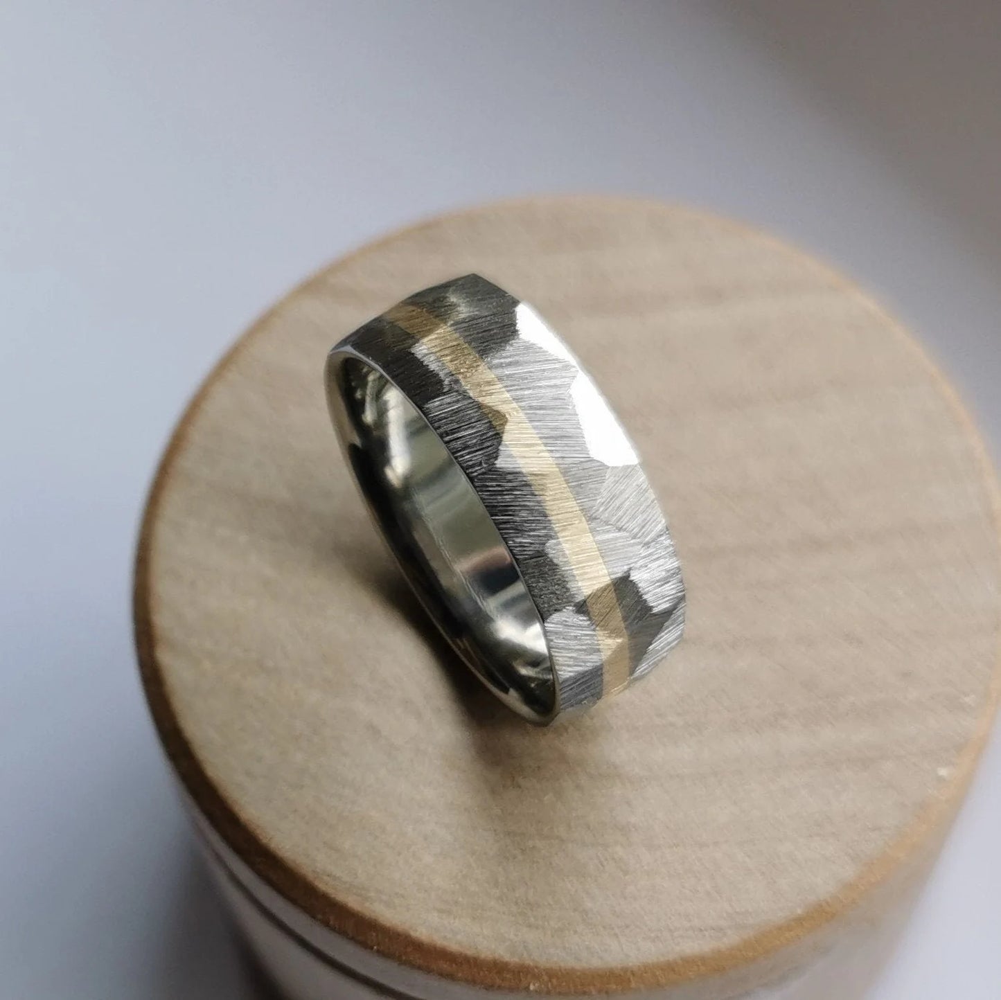 Handmade Faceted Titanium Ring with Solid Gold Channel.