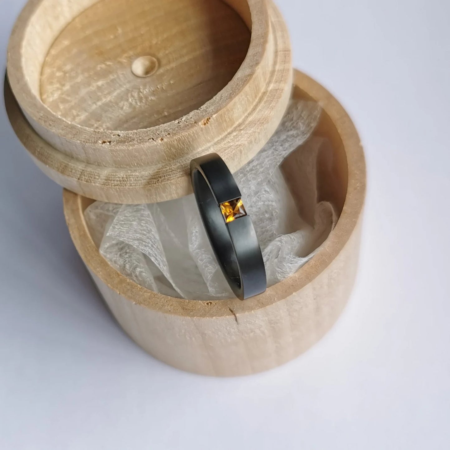 Handmade Brushed Black Zirconium Tension Ring with Princess Cut Stone Setting.