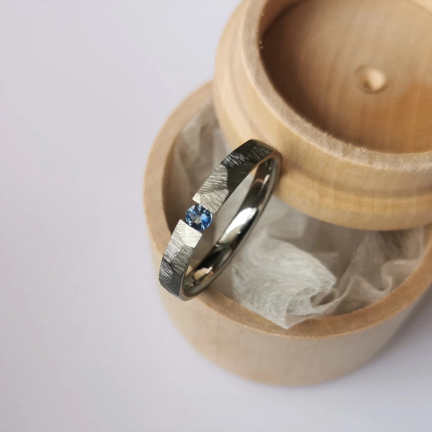 Unique Handmade Faceted Titanium Tension Ring with Round Brilliant Cut Stone Setting.