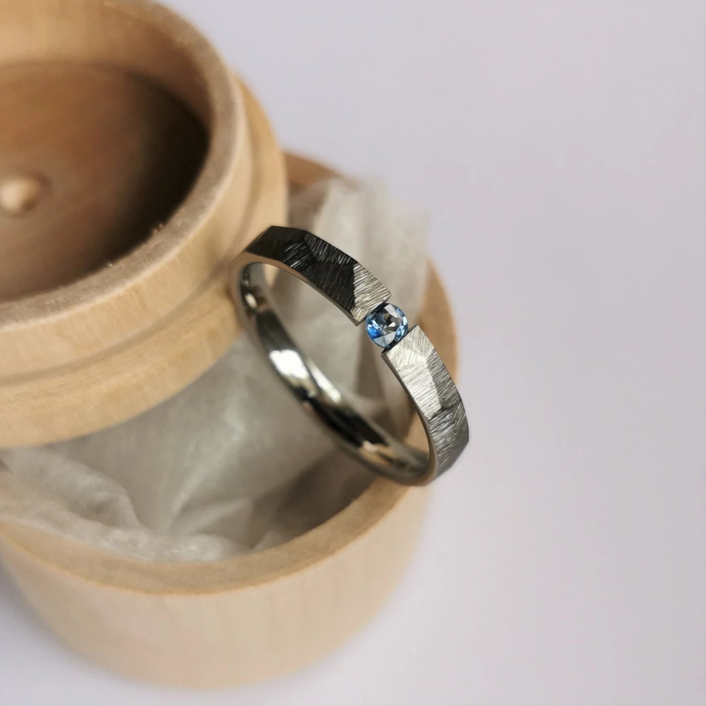 Unique Handmade Faceted Titanium Tension Ring with Round Brilliant Cut Stone Setting.