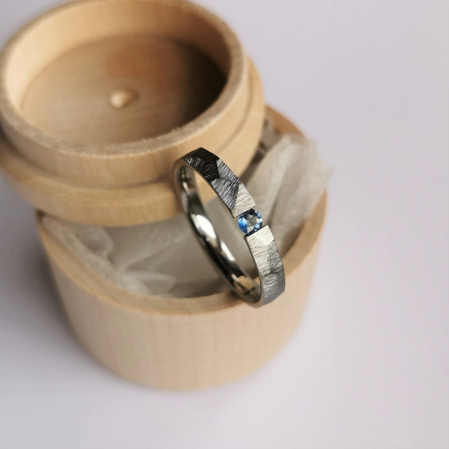 Unique Handmade Faceted Titanium Tension Ring with Round Brilliant Cut Stone Setting.