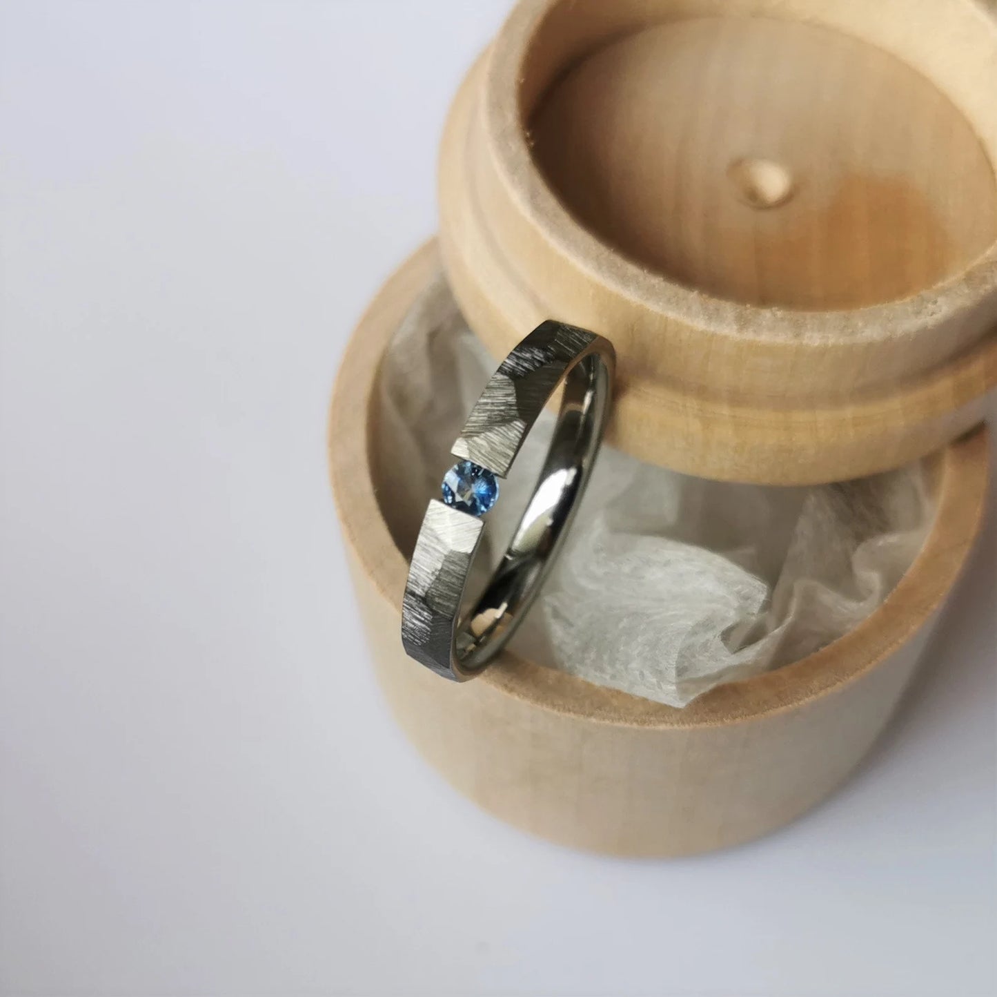 Unique Handmade Faceted Titanium Tension Ring with Round Brilliant Cut Stone Setting.