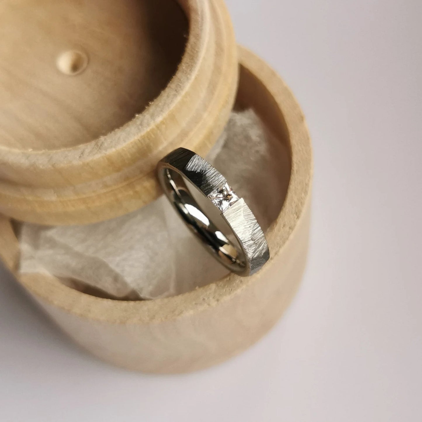 Unique Handmade Faceted Titanium Tension Ring with Square Princess Cut Stone Setting.