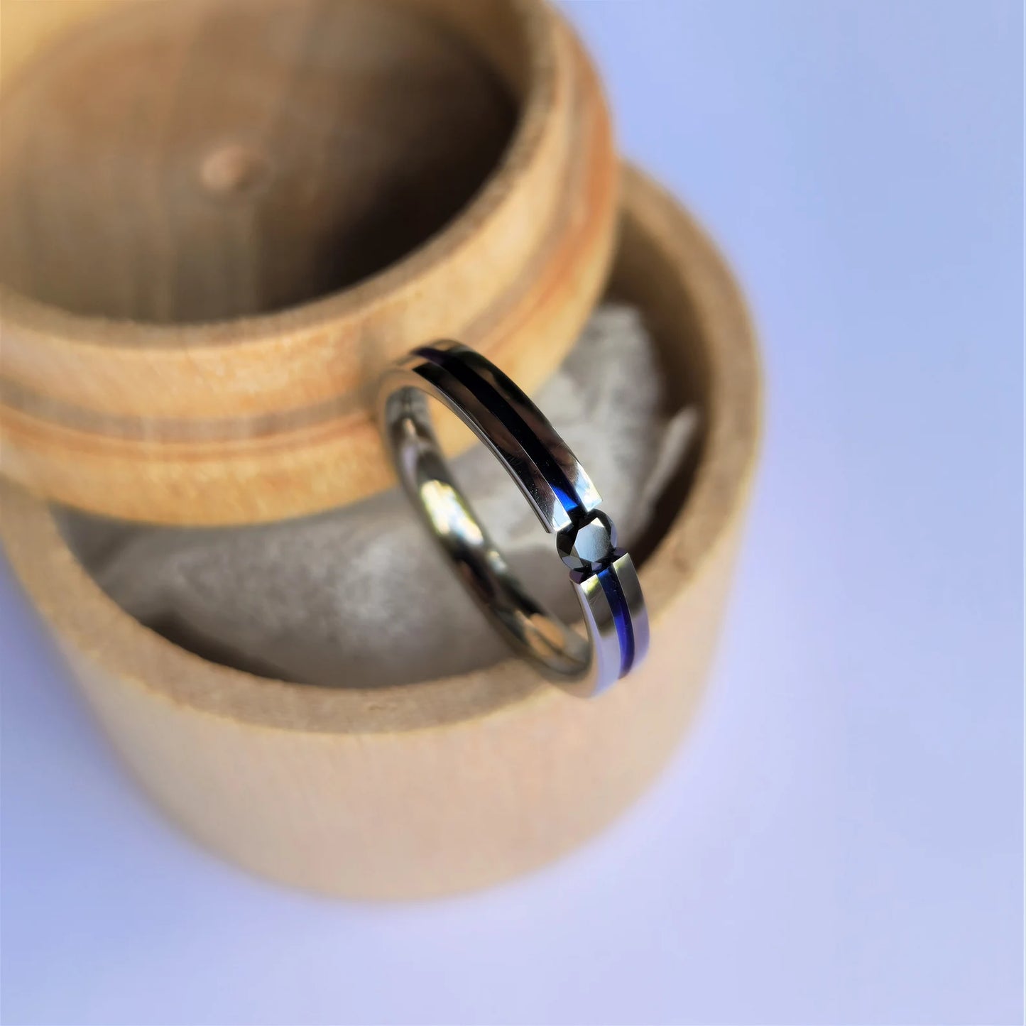 Unique Handmade Polished Titanium Tension Ring with Round Brilliant Cut Stone Setting and Anodized Channel.