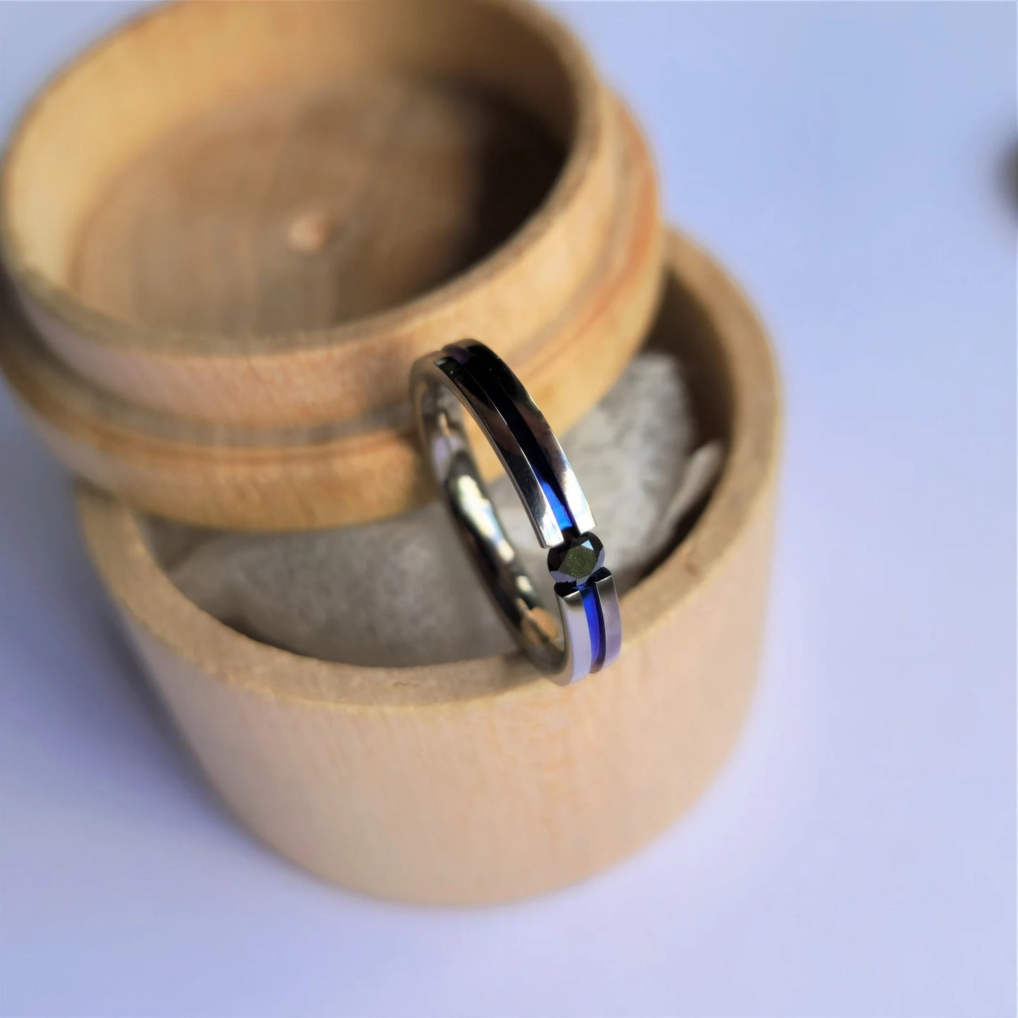 Unique Handmade Polished Titanium Tension Ring with Round Brilliant Cut Stone Setting and Anodized Channel.