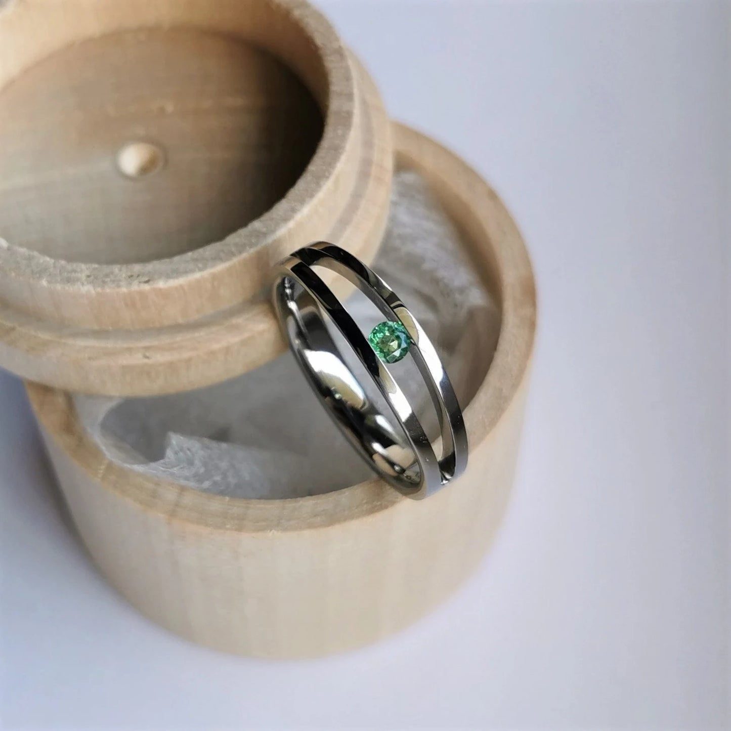 Unique Handmade Polished Titanium Tension Ring with Diamond Cut Stone Setting.