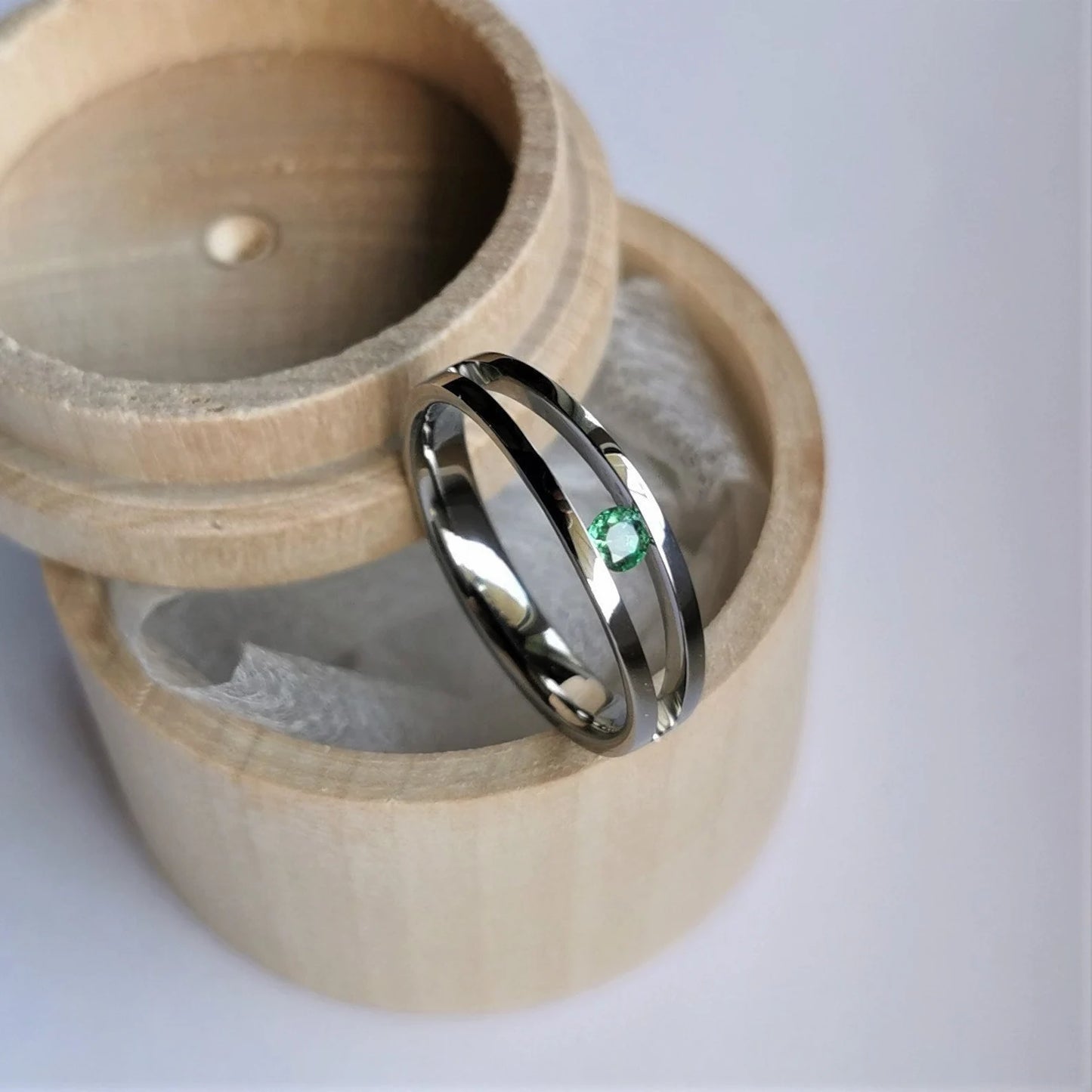 Unique Handmade Polished Titanium Tension Ring with Diamond Cut Stone Setting.